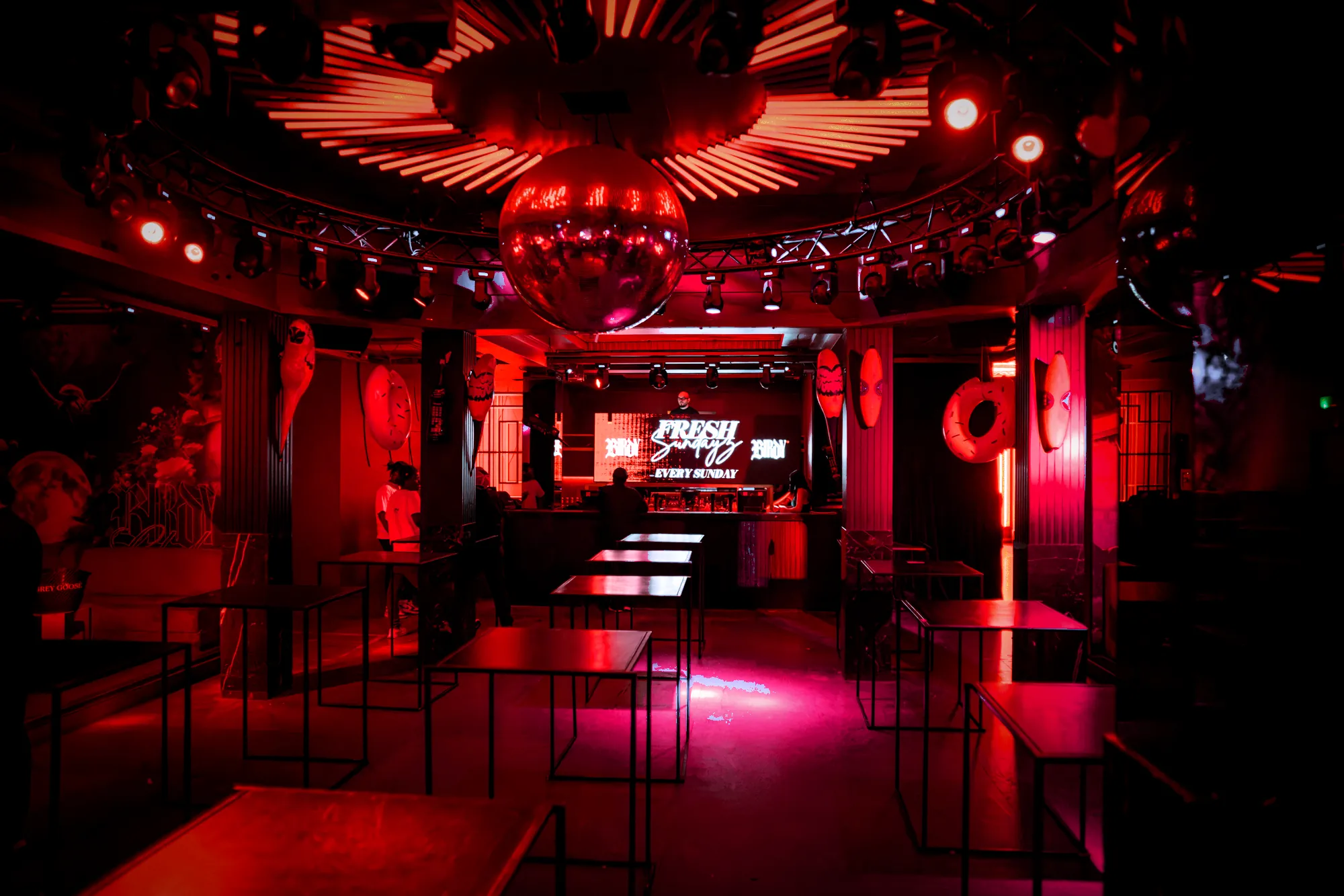 Birdy dance floor under the mirror ball in red light, Brussels nightclub